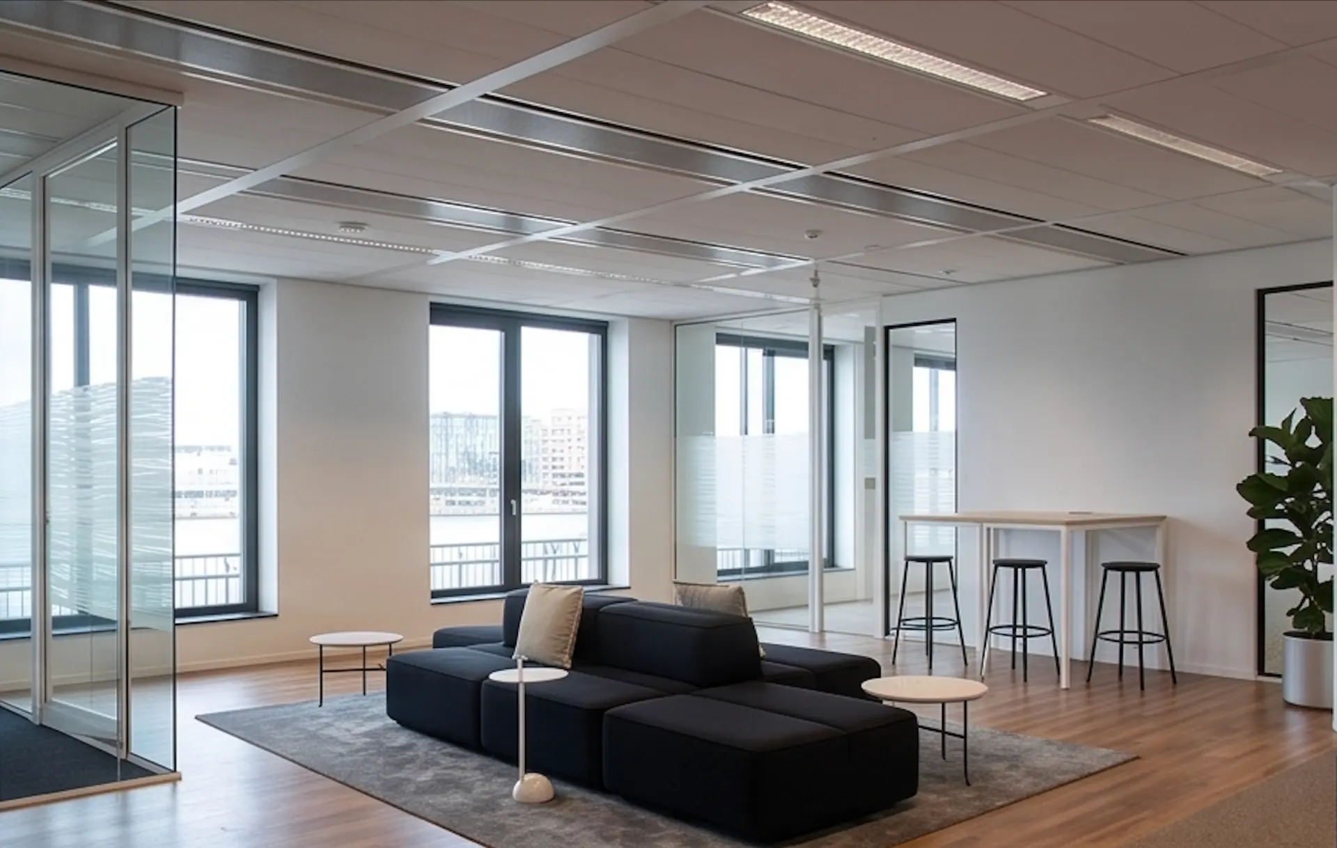 Waterfront private office with a lounge and collaboration table